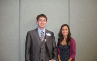 Automated AWS Rekognition Person, Human, Clothing, Apparel, Tie, Accessories, Accessory, Suit, Coat, Overcoat, Blazer, Jacket, Fashion, Tuxedo, Long Sleeve, Sleeve