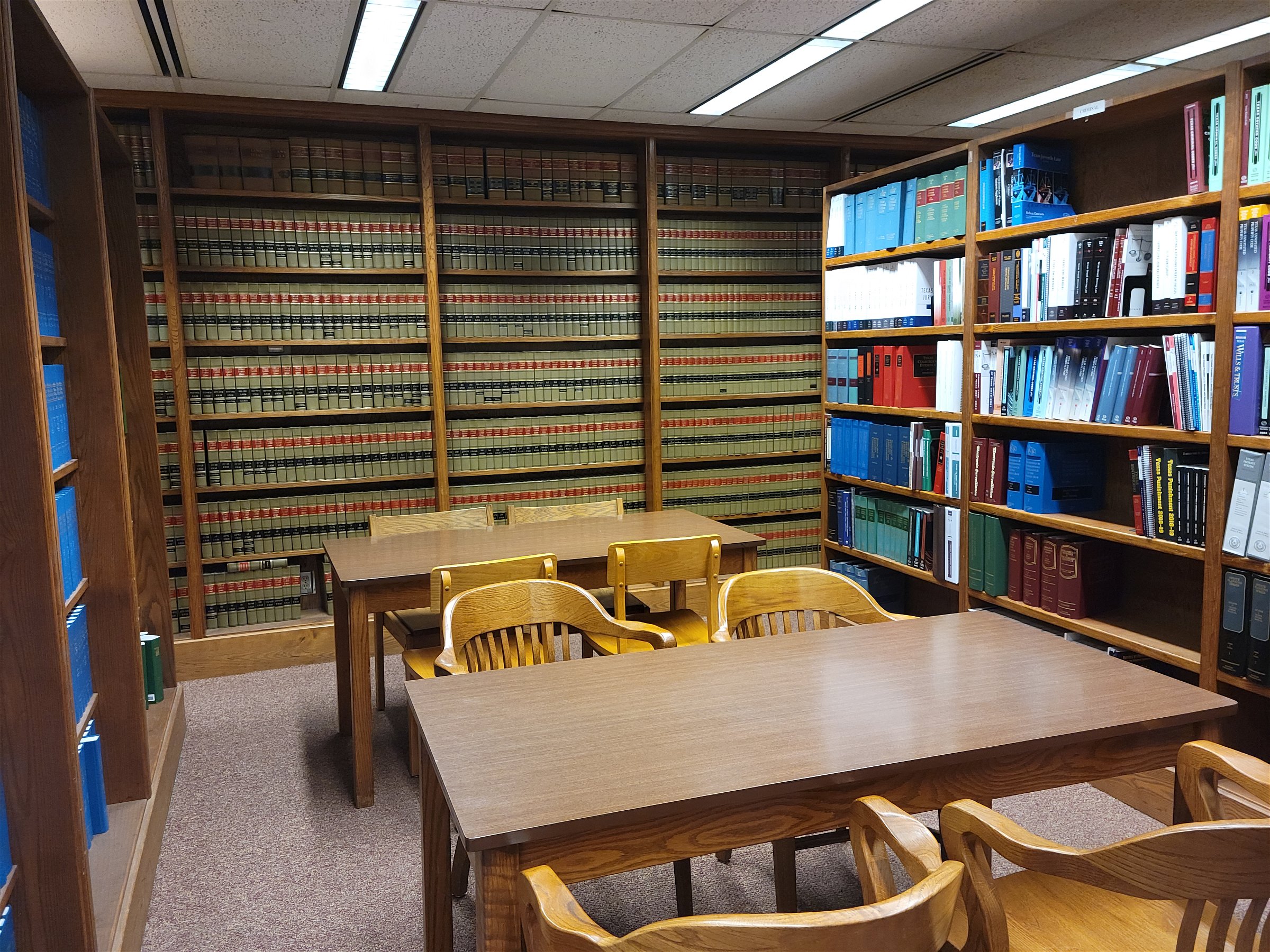 law library with tables and chairs and law books on bookshelves